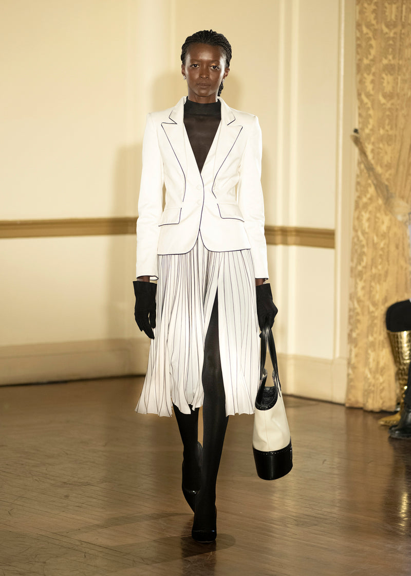 Look 1: Alabaster Piped Lapel Jacket and Striped Pleated Skirt